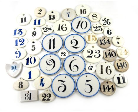 A collection of ceramic bin labels, some by Farrow and Jackson, various designs, with black and blue numbers. (43)