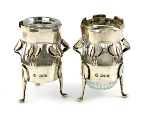 By William Hutton and Sons, a pair of Edwardian Art Nouveau silver vases, London 1903, circular form, the bodies with a pierc