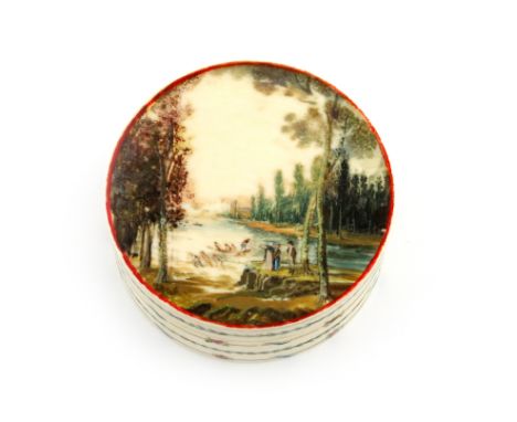 λ A late 18th / early 19th century ivory snuff box, circa 1800, circular form, the pull-off cover painted with figures in a l