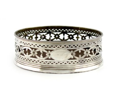 A George III silver wine coaster, probably by Hester Bateman, London 1787, circular form, pierced and engraved decoration, be