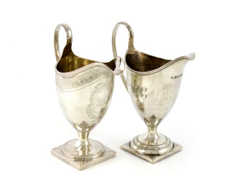 A George III silver cream jug, by Urquhart and Hart, London 1795, helmet form, loop handle, engraved decoration, on a raised 