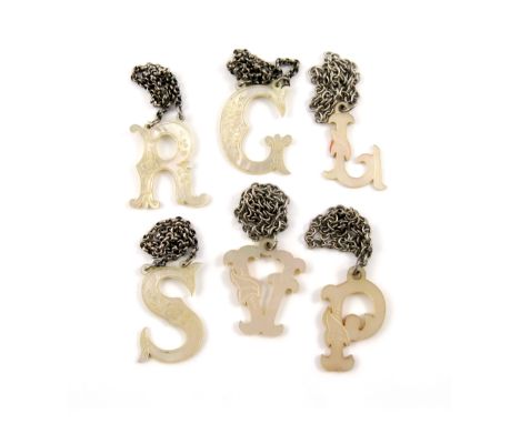 A collection of six Victorian mother-of-pearl 'cut-out letter' wine labels, engraved decoration, modelled as the letters 'P',