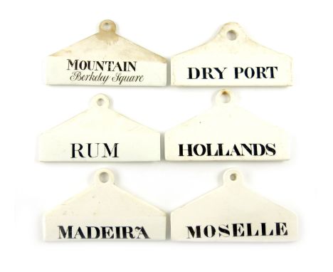 A collection of six 19th century ceramic bin labels, some by Wedgwood, arched rectangular form, titled in black 'MOUNTAIN Ber