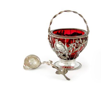 A George III silver swing-handled cream pail, by Emile Roker, London 1771, circular wire-work form, applied with birds and fo