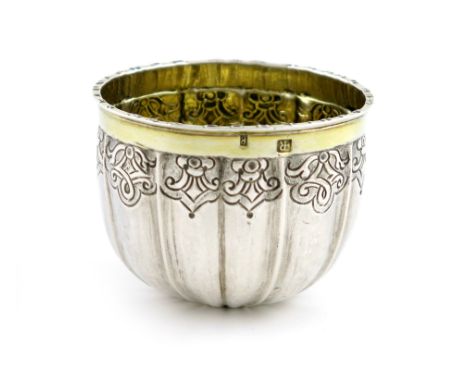 An Austrian silver tumbler cup, marked with a duty stamp and a 'B', formed from a coin, milled edge, chased foliate scroll de