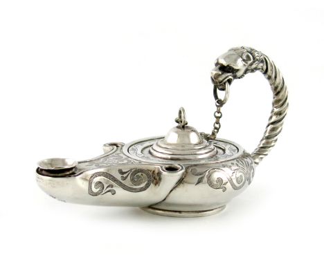A Victorian silver inkwell, by James Edington, London 1846, modelled as a classical oil lamp, scroll handle with a lion mask,
