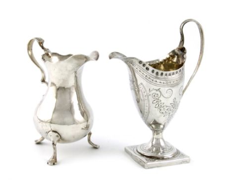 A George III silver cream jug, by Peter and Ann Bateman, London 1791, helmet form, scroll handle, engraved decoration, punch 