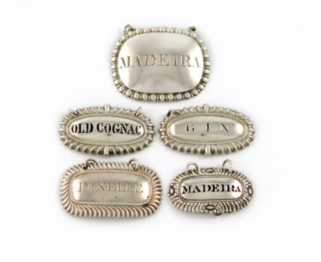 A collection of five 19th century silver wine labels, broad rectangular form, gadroon borders, incised and pierced  'OLD COGN