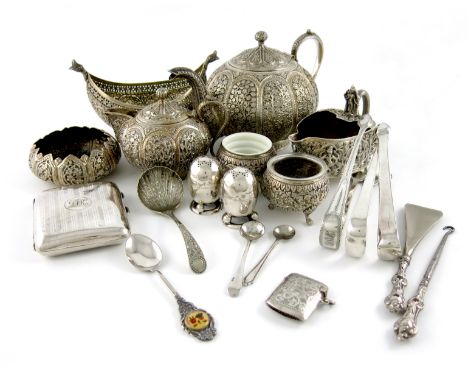 A mixed lot of silver items, comprising: an Indian teapot and cream jug, of circular form, chased panels of foliate decoratio