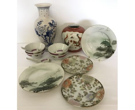 A collection of oriental ceramics.  Comprising: 3 modern soup bowls and 3 spoons, a blue an white vase depicting bird sitting