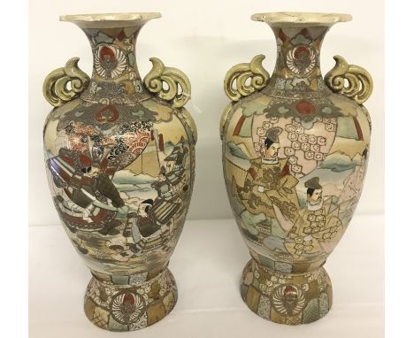 A pair of Japanese ceramic slim necked vases with gilded decoration.  Hand painted samurai scenes to bowl surrounds. One a/f.