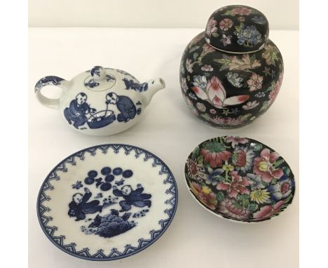 4 pieces of oriental ceramics.  Comprising a small blue and white teapot, a blue and white small dish depicting young childre