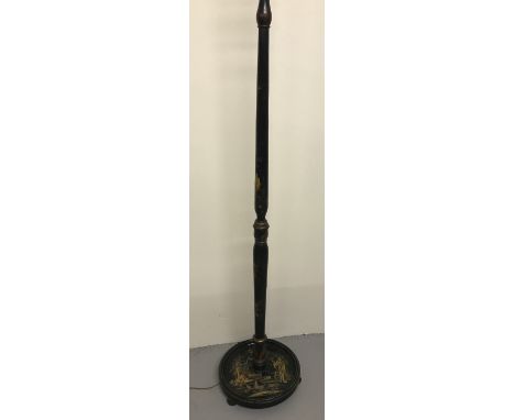 A Chinese black lacquer standard lamp with hand painted scene to base and detail to upright. On 3 bun feet. Approx. 153cm tal