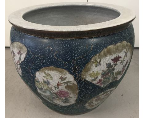 A large ceramic Chinese fishbowl with crackle glaze effect. Floral and bird panel decoration to bowl surround and hand painte