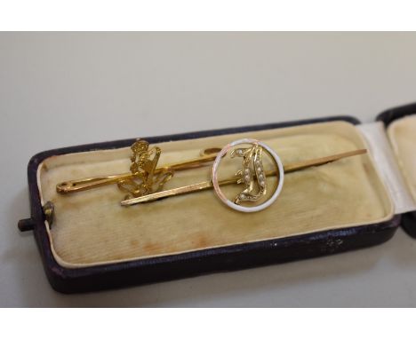 A gold sweetheart bar brooch;&nbsp;together with a seed pearl and enamel example, both stamped 9ct, 5g total weight. 