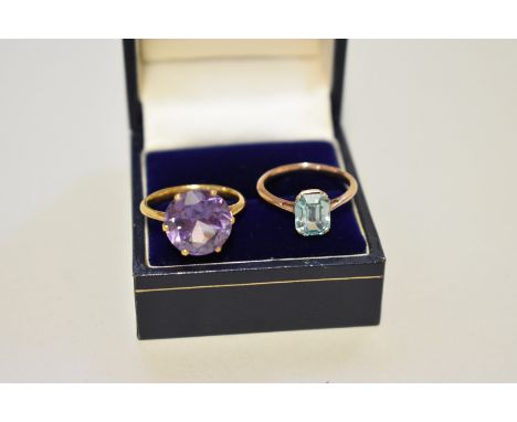 Two unmarked yellow metal dress rings, set amethyst and aquamarine, 7.2g total weight. 