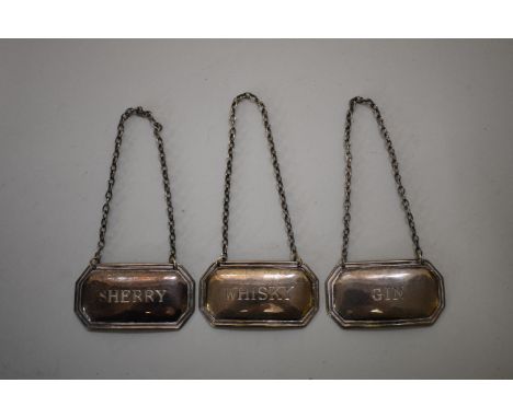 Three silver decanter labels,&nbsp;sherry, whisky &amp; gin, by&nbsp;Francis Howard Ltd,&nbsp;Sheffield 1982/3/7, 28g. 