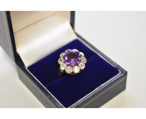 An amethyst and diamond unmarked yellow metal dress ring,&nbsp;&nbsp;the&nbsp;diamonds&nbsp;approximately 1ct, 5.3g total wei