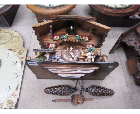 A 20th Century German automaton cuckoo clock depicting a watermill with figures, 29cm high, pendulum and weights