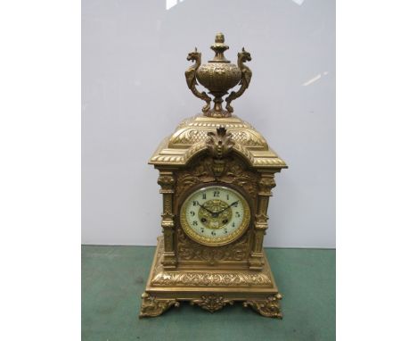 A French decorative brass mantel clock with urn finial, 48cm high