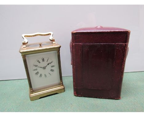 A late 19th Century French carriage clock, jewelled lever movement, strike mechanism with repeat button, white enamel dial wi