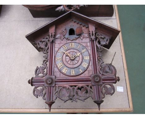A late 19th Century Black Forest cuckoo wall clock with carved decoration and pendulum (wormed)  40cm high