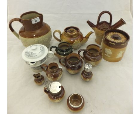 A collection of Doulton and other stoneware to include a Charles Haskings Poultry Cross, Salisbury "Original Salisbury Kettle