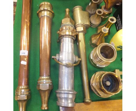 A collection of vintage copper and brass fire branch pipes and nozzles including a long branch pipe and nozzle by Shand Mason