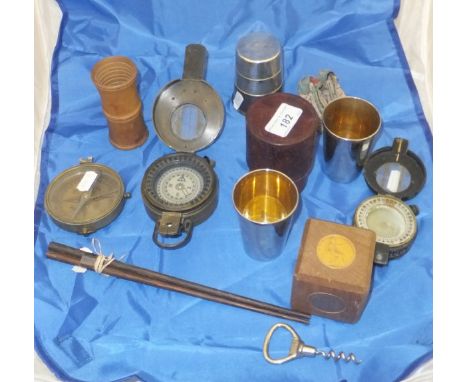 A World War II brass military compass inscribed "TG Co Ltd London MKIII 1941", a black painted brass military compass inscrib
