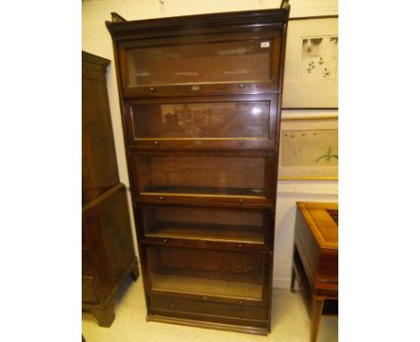 A pair of Lebus stained beech five section bookcases in the Globe Wernicke manner, each brass lock plate inscribed "The Lebus