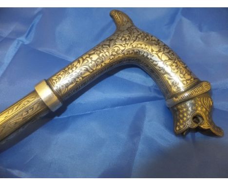 A Middle Eastern Niello decorated walking cane, the handle in the form of a mythical beast CONDITION REPORTS There is some ro