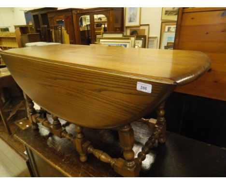 An Ercol mid elm gate-leg coffee table