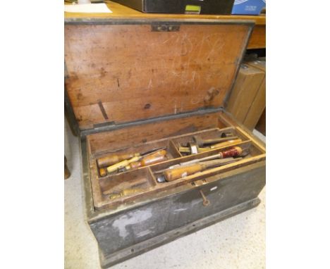 A woodworker's black painted pine chest, together with a large quantity of various hand tools to include lathe gouge, bevel, 