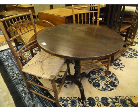 A 19th century circular oak snap-top table on single turned column to tripod base, together with two similar Arts and Crafts 