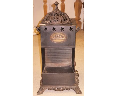 An "Albion Lamp Company" paraffin heater, bears plaque to front