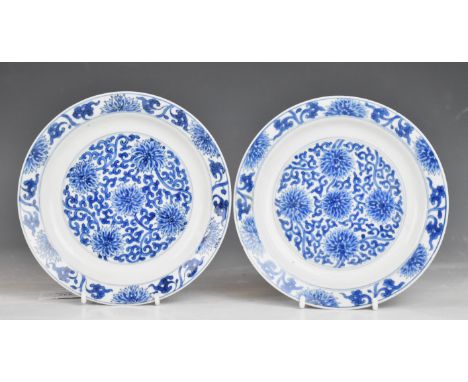 Pair of Chinese shallow blue and white dishes with chrysanthemum decoration and six character Kangxi mark to base, diameter 1