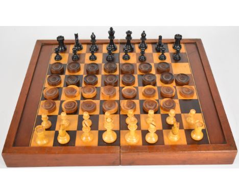 A large folding chess and backgammon board together with boxwood chess and draught sets, 45 x 38cm unfolded.