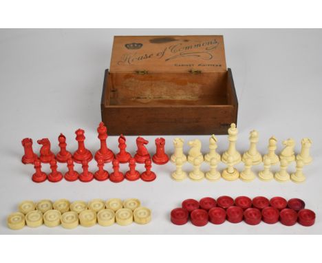 A carved bone chess set with one side stained red, together with a similar draughts set, height of king 7cm.