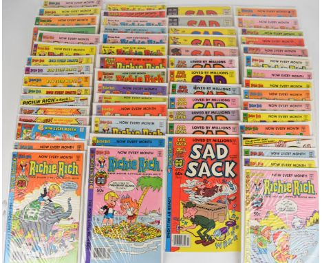 Sixty-two Silver and Bronze Age Harvey comics comprising fifty Richie Rich and twelve Sad Sack, all of a high grade, bagged a
