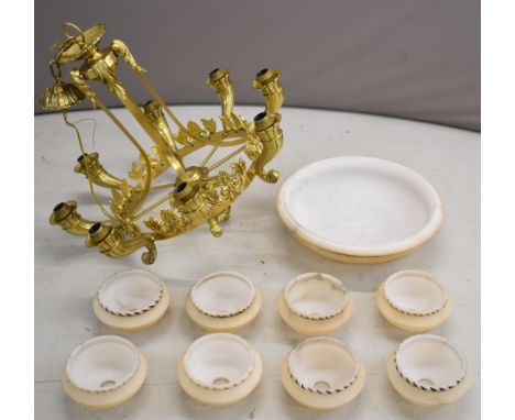 Gilt metal eight branch chandelier with carved alabaster shades, overall height 78cm, diameter 90cm