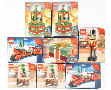 Eight Lego Christmas sets comprising two Train 40138, two Carousel 40293, two Snow Globe 40223, Gift Box 40292 and Nutcracker