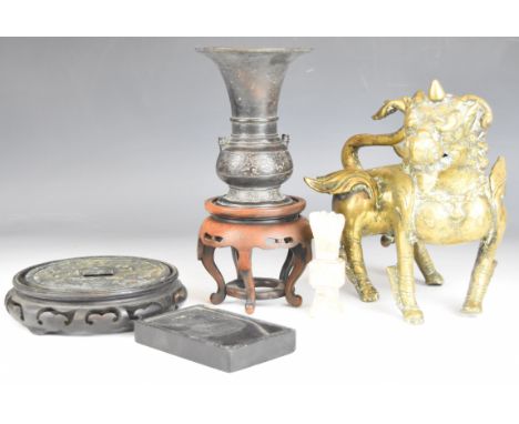 Chinese hardwood stands, brass Dog of Fo figure, bronze disc and vase (no base) etc, tallest 22cm