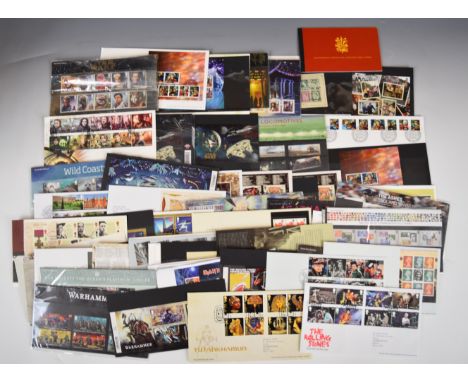 A collection of GB presentation packs, first day covers and prestige booklets, high face value