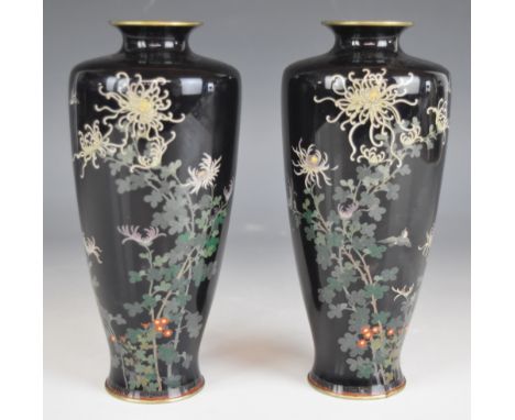 A pair of Japanese cloisonné enamel vases with decoration of birds, flowers and foliage on navy blue ground, each marked in r