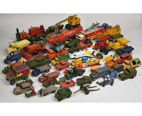 Over fifty vintage Dinky, Corgi and Matchbox diecast model cars and trucks, to include construction and military examples.