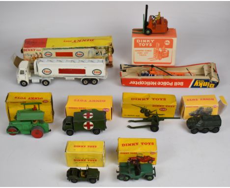 Nine Dinky Toys diecast model cars, trucks and similar vehicles to include Universal Jeep 405, AEC Fuel Tanker Esso 945, Cove