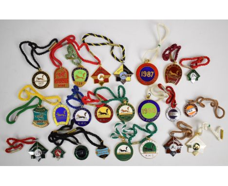 A collection of metal and enamel Irish horse racing badges including Naas Races 1949 onwards, Navan Races, Punchestown 1974 o