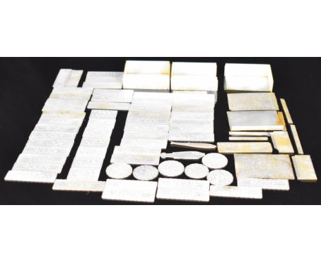 Sixty Chinese mother of pearl gaming counters contained in three mother of pearl boxes, all with engraved decoration, length 