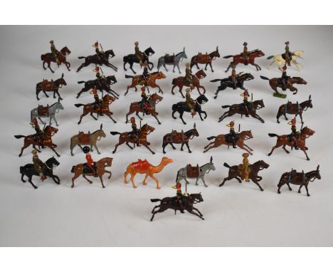 Thirty-two various Britains painted metal toy soldiers comprising mounted regiments and artillery ordnance carriers.