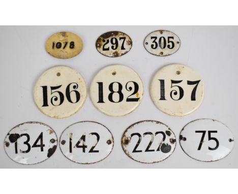 Seven enamel wine bin label / tickets, largest W8.5 x H7cm and three ceramic examples, diameter 8.5cm